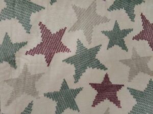 Tela coralina al corte estrellas